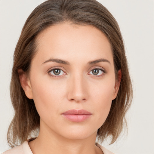 Neutral white young-adult female with medium  brown hair and grey eyes