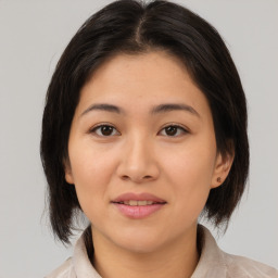 Joyful asian young-adult female with medium  brown hair and brown eyes