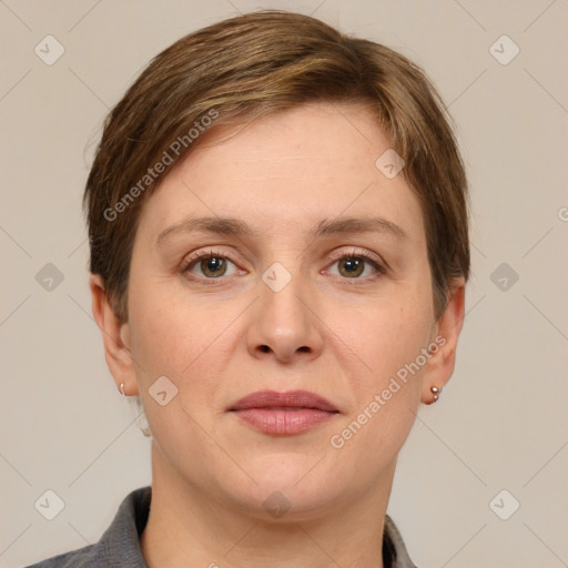 Joyful white adult female with short  brown hair and grey eyes