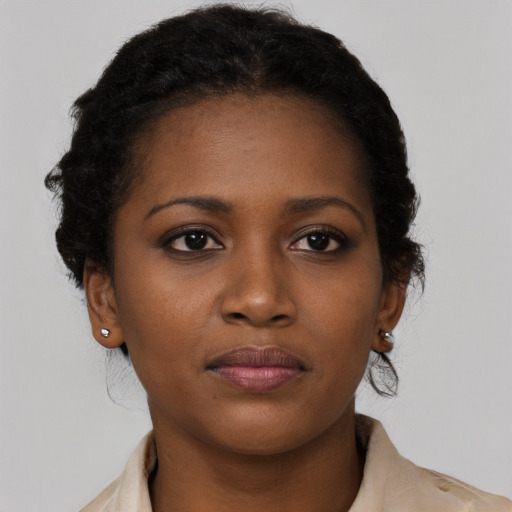 Neutral black young-adult female with medium  brown hair and brown eyes