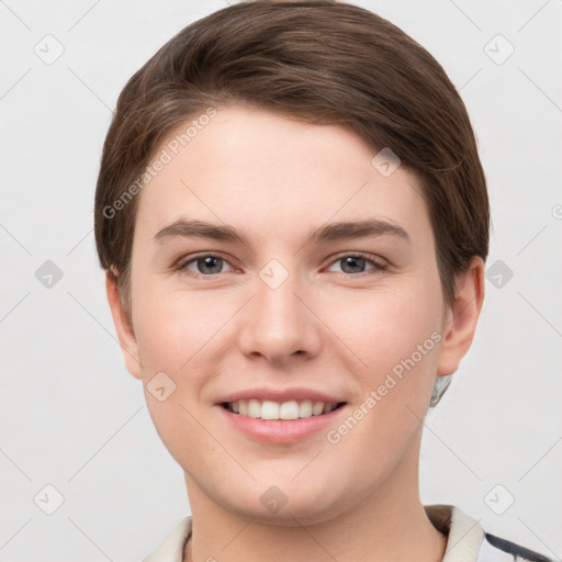 Joyful white young-adult female with short  brown hair and grey eyes