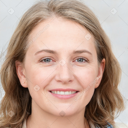 Joyful white young-adult female with medium  brown hair and blue eyes