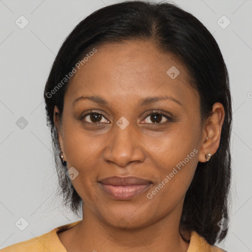 Joyful black adult female with medium  brown hair and brown eyes