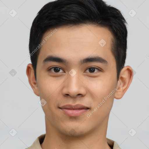 Joyful asian young-adult male with short  black hair and brown eyes