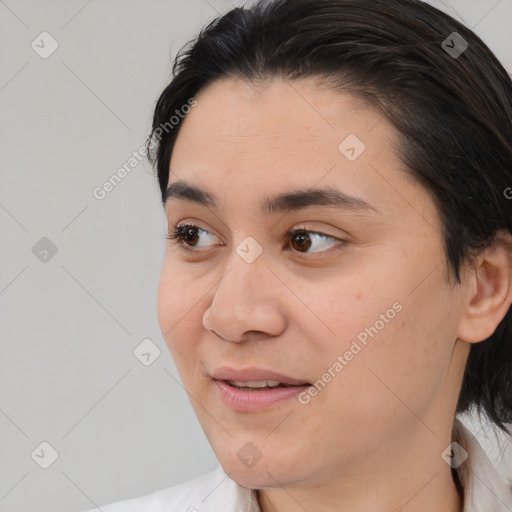 Joyful white young-adult female with medium  brown hair and brown eyes