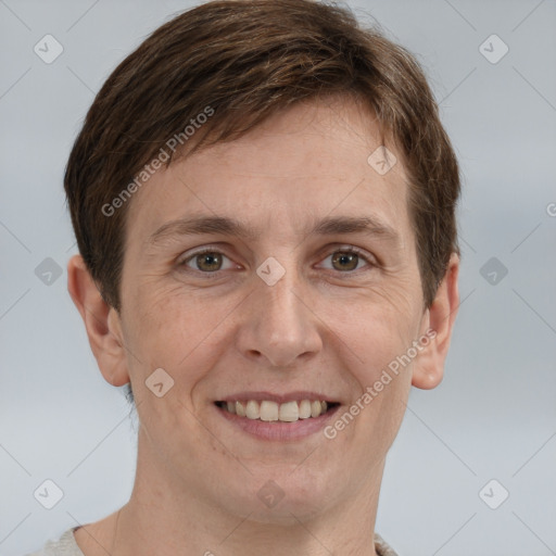 Joyful white adult male with short  brown hair and grey eyes