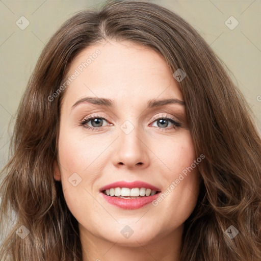 Joyful white young-adult female with long  brown hair and green eyes