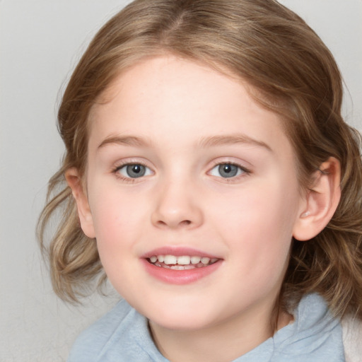 Joyful white child female with medium  brown hair and blue eyes