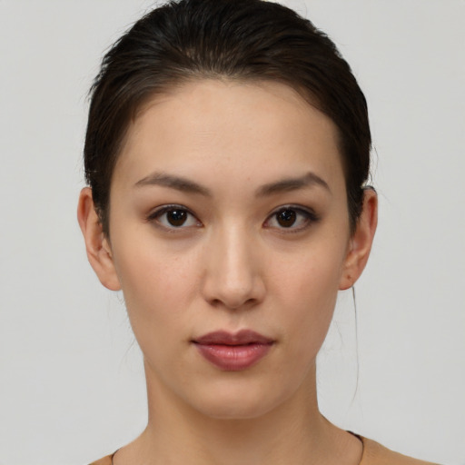 Neutral white young-adult female with short  brown hair and brown eyes