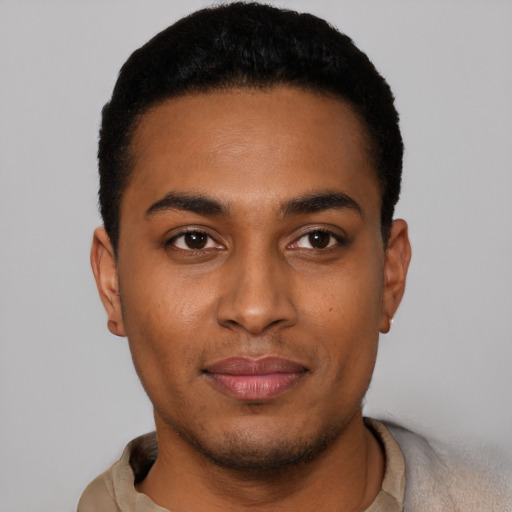 Joyful latino young-adult male with short  black hair and brown eyes