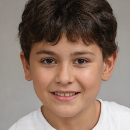 Joyful white child male with short  brown hair and brown eyes