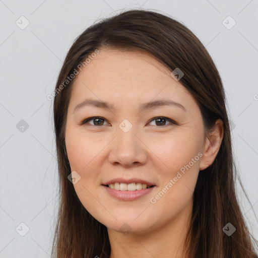 Joyful white young-adult female with long  brown hair and brown eyes