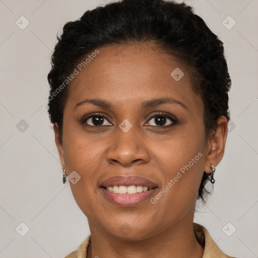 Joyful black young-adult female with short  brown hair and brown eyes