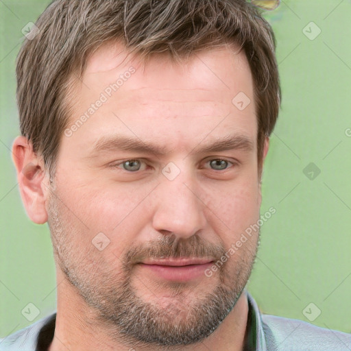 Joyful white adult male with short  brown hair and grey eyes