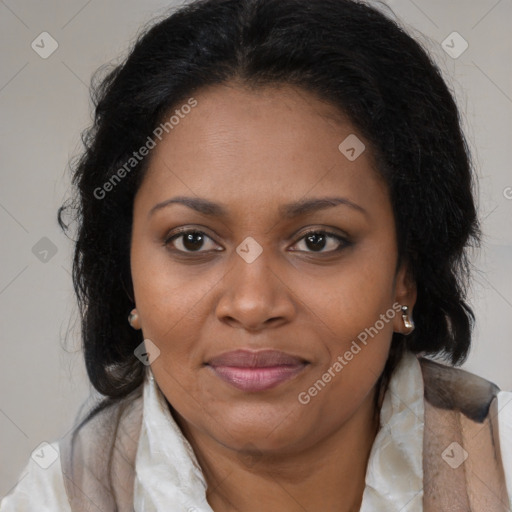 Joyful black adult female with medium  brown hair and brown eyes