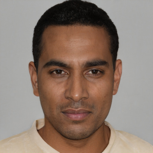 Neutral black young-adult male with short  black hair and brown eyes