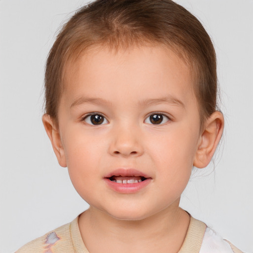 Joyful white child male with short  brown hair and brown eyes