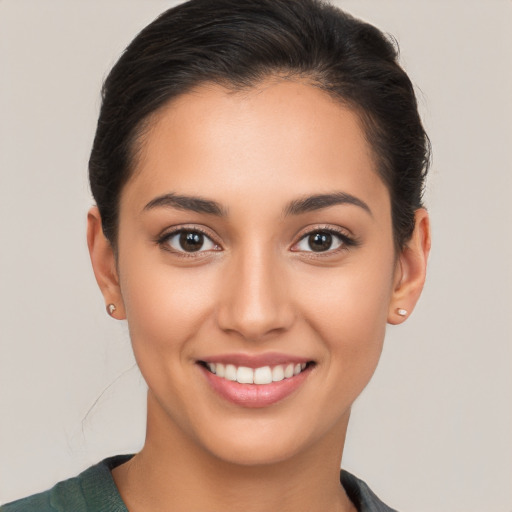 Joyful white young-adult female with short  brown hair and brown eyes