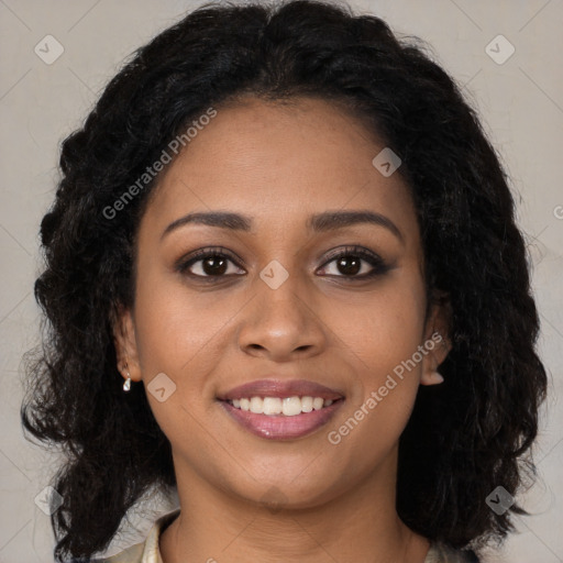 Joyful black young-adult female with long  brown hair and brown eyes