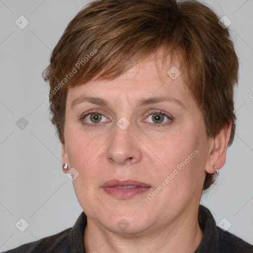 Joyful white adult female with medium  brown hair and blue eyes