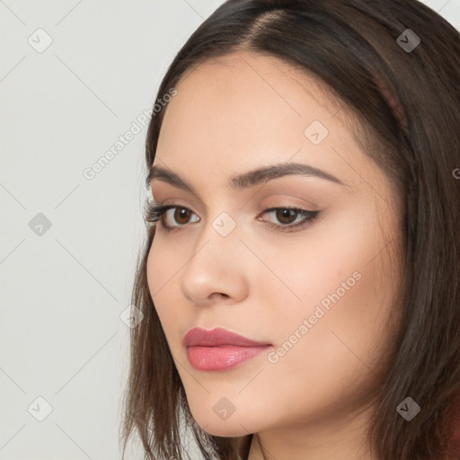 Neutral white young-adult female with long  brown hair and brown eyes