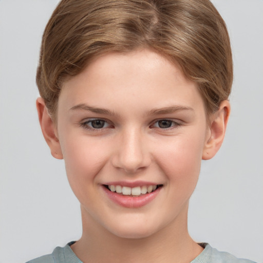 Joyful white child female with short  brown hair and grey eyes