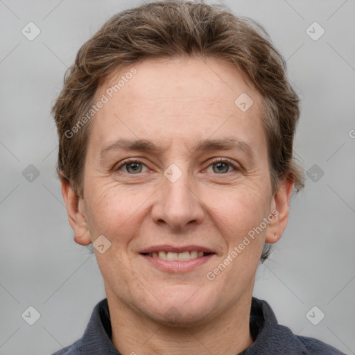 Joyful white adult male with short  brown hair and grey eyes