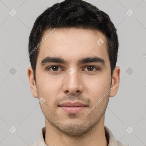 Neutral white young-adult male with short  black hair and brown eyes