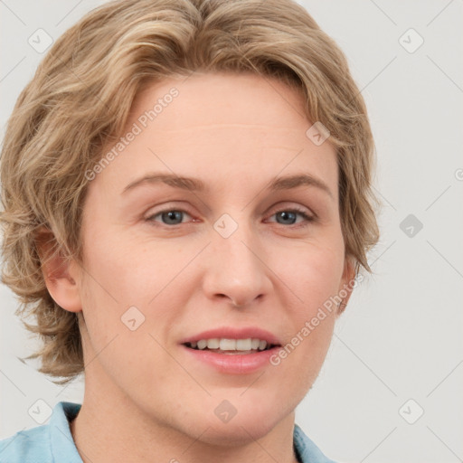 Joyful white adult female with short  brown hair and blue eyes