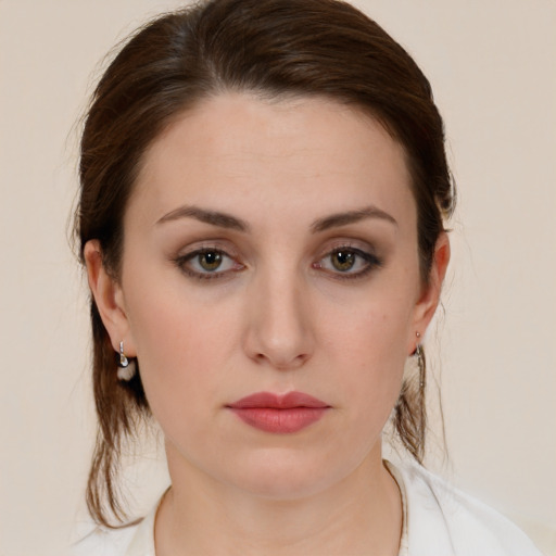 Neutral white young-adult female with medium  brown hair and brown eyes