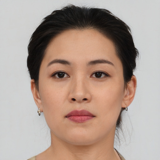 Neutral asian young-adult female with medium  brown hair and brown eyes