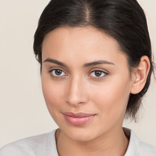 Joyful white young-adult female with medium  brown hair and brown eyes