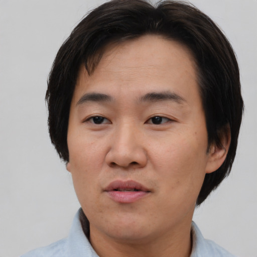 Neutral asian young-adult male with short  black hair and brown eyes