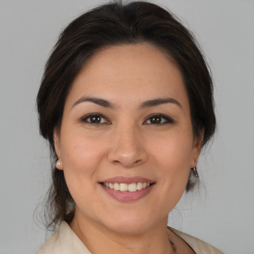 Joyful white young-adult female with medium  brown hair and brown eyes