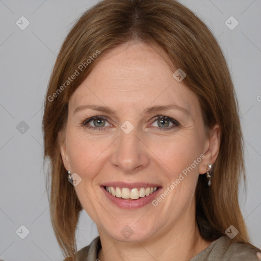 Joyful white adult female with medium  brown hair and grey eyes