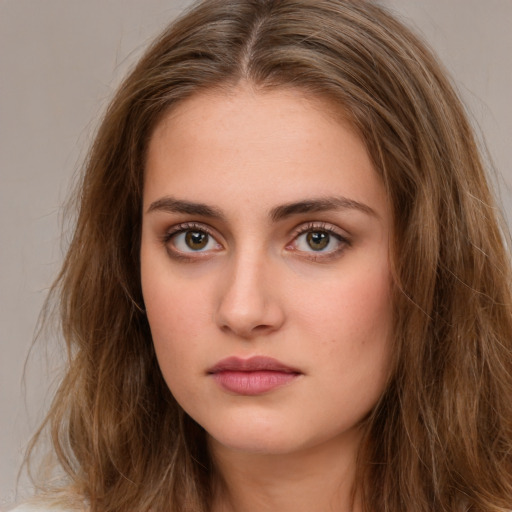 Neutral white young-adult female with long  brown hair and brown eyes