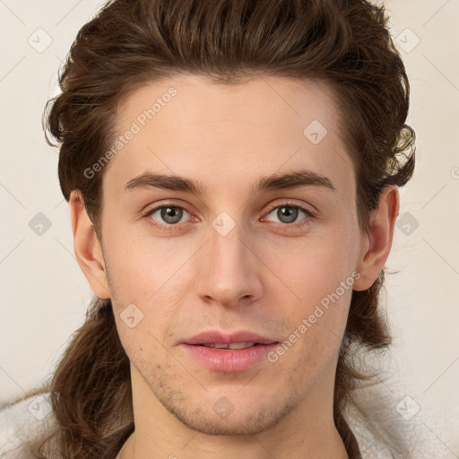 Joyful white young-adult male with medium  brown hair and brown eyes