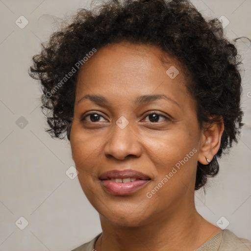 Joyful black adult female with medium  brown hair and brown eyes