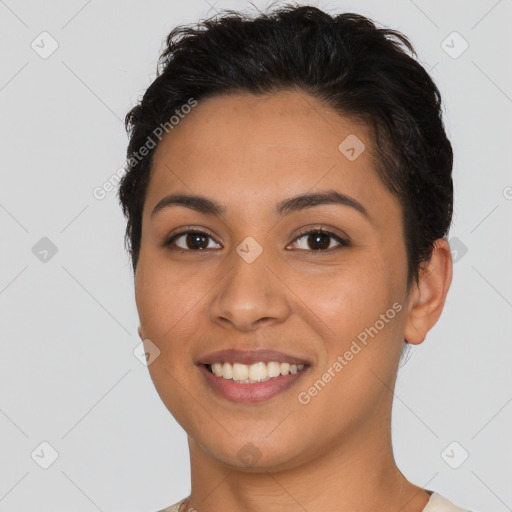 Joyful latino young-adult female with short  brown hair and brown eyes