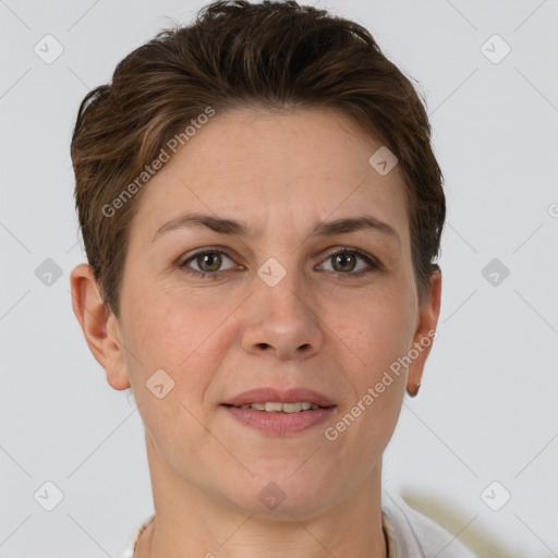 Joyful white adult female with short  brown hair and grey eyes