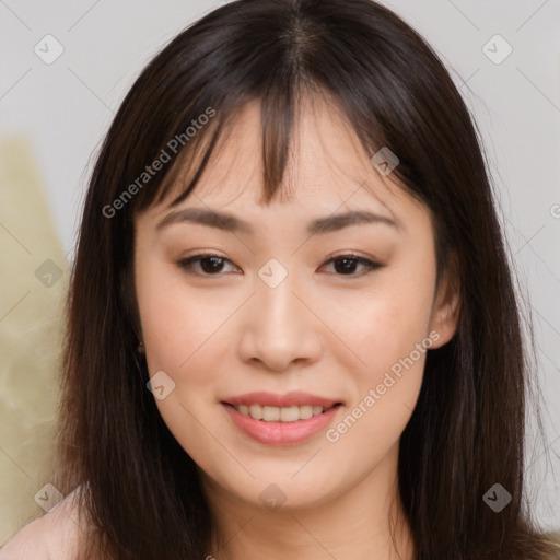 Joyful asian young-adult female with long  brown hair and brown eyes