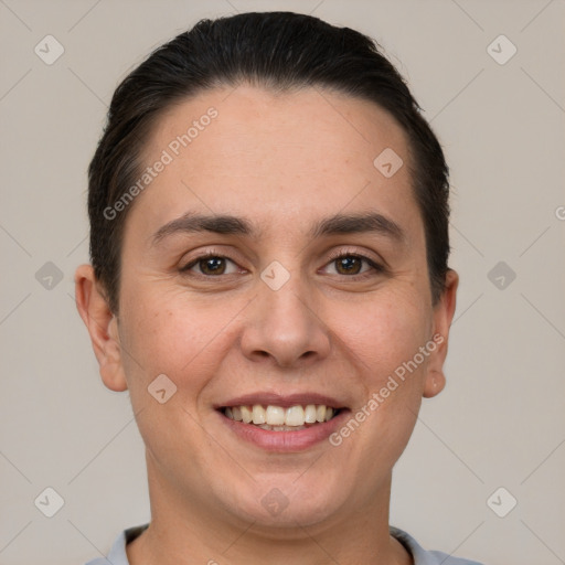 Joyful white young-adult female with short  brown hair and brown eyes