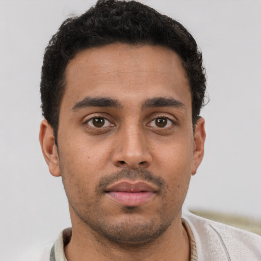 Neutral latino young-adult male with short  brown hair and brown eyes
