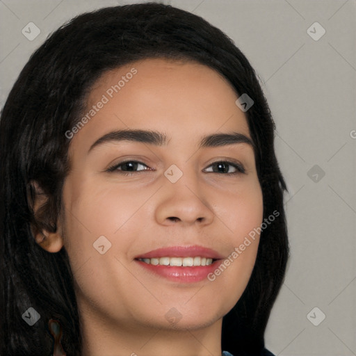 Joyful latino young-adult female with long  black hair and brown eyes