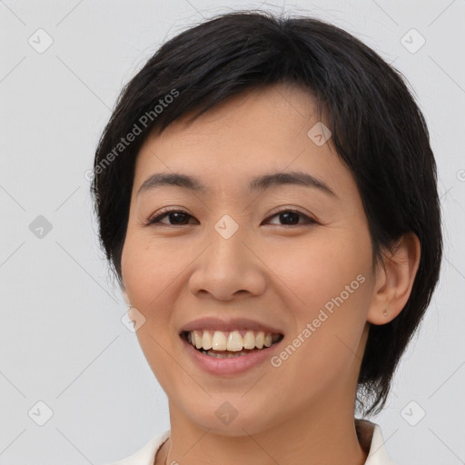 Joyful asian young-adult female with medium  black hair and brown eyes