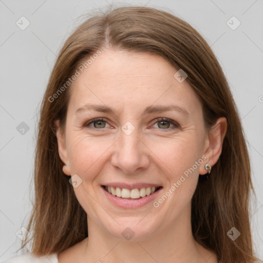 Joyful white adult female with medium  brown hair and grey eyes