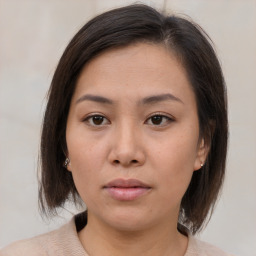 Neutral asian young-adult female with medium  brown hair and brown eyes