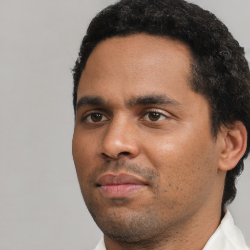 Neutral black young-adult male with short  black hair and brown eyes
