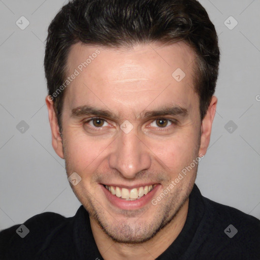 Joyful white adult male with short  brown hair and brown eyes