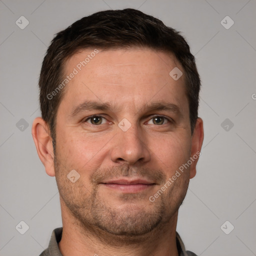 Joyful white adult male with short  brown hair and brown eyes